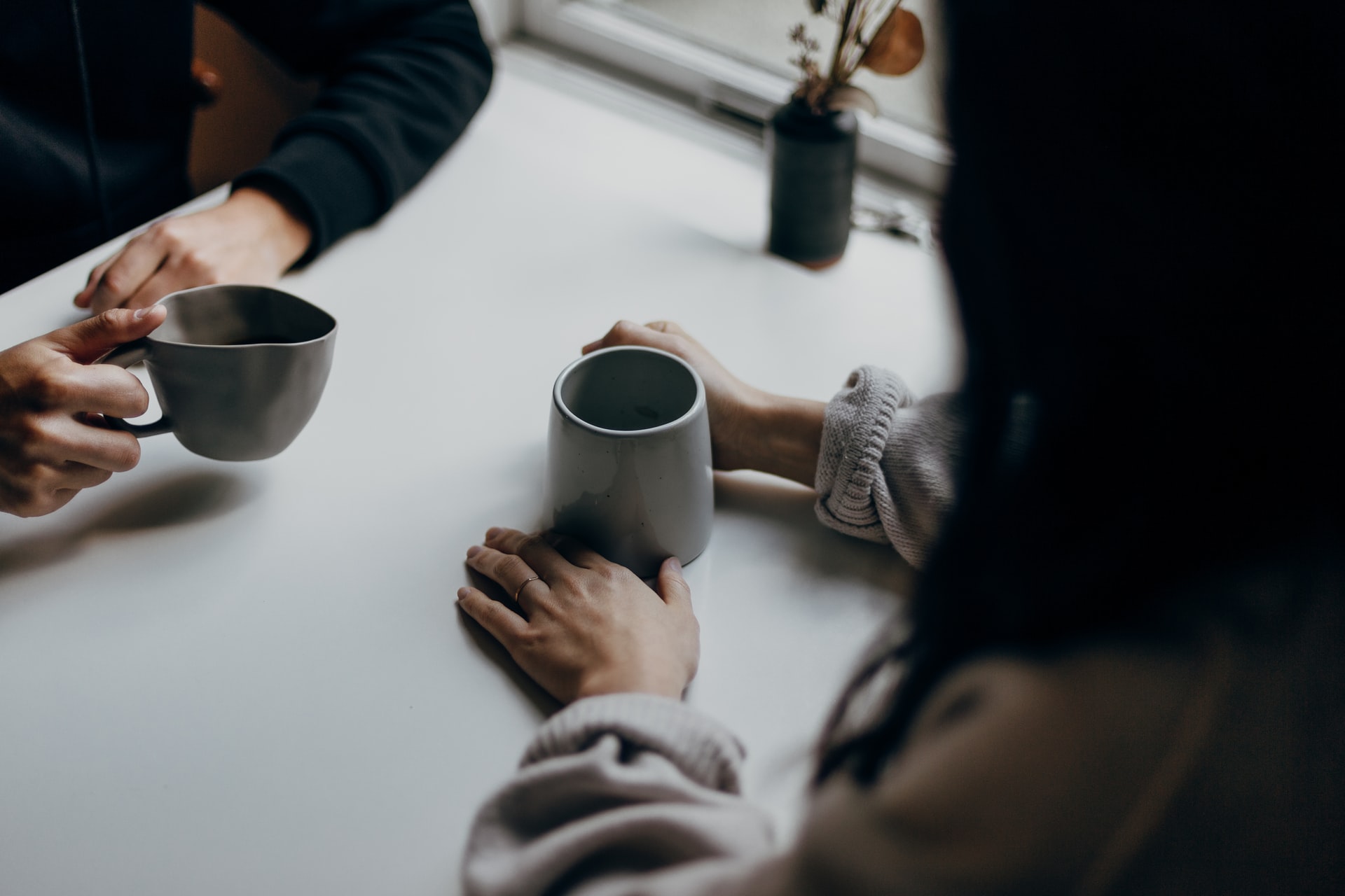 close-up-of-two-people-having-coffee