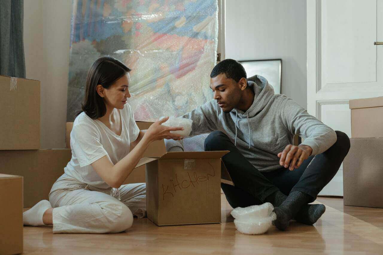 man-and-woman-moving-boxes