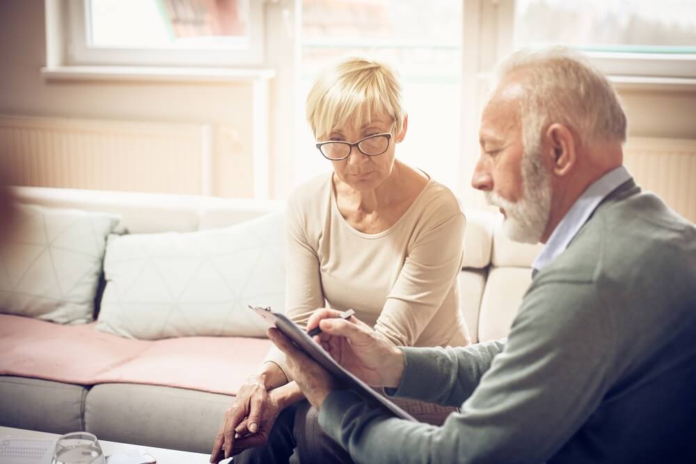 elderly-couple-looking-at-paper