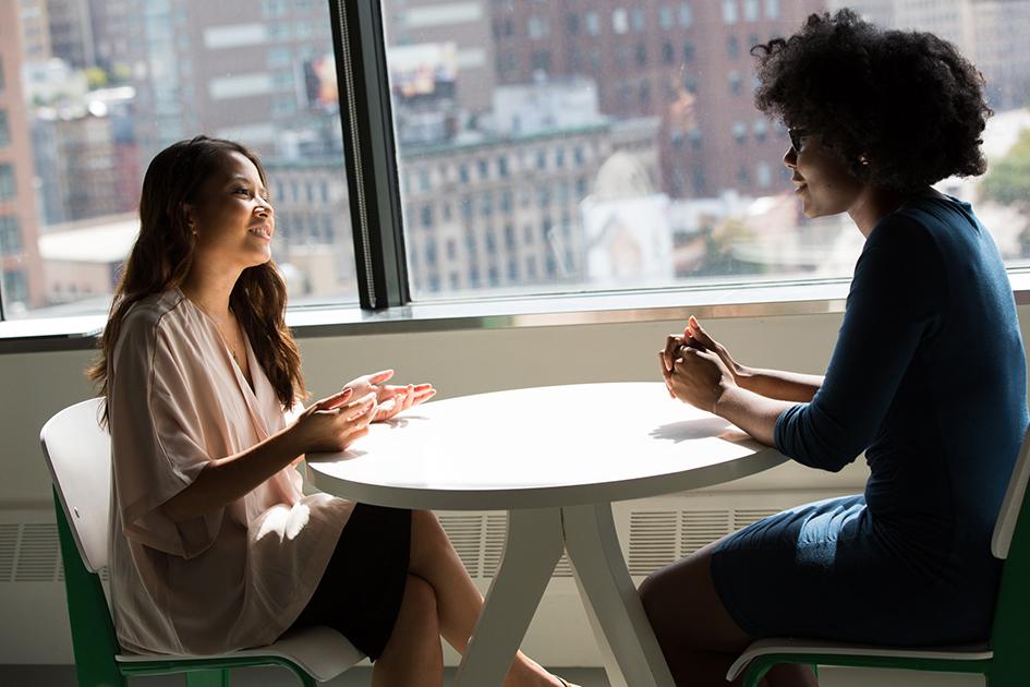 Two-females-talking-across-a-table