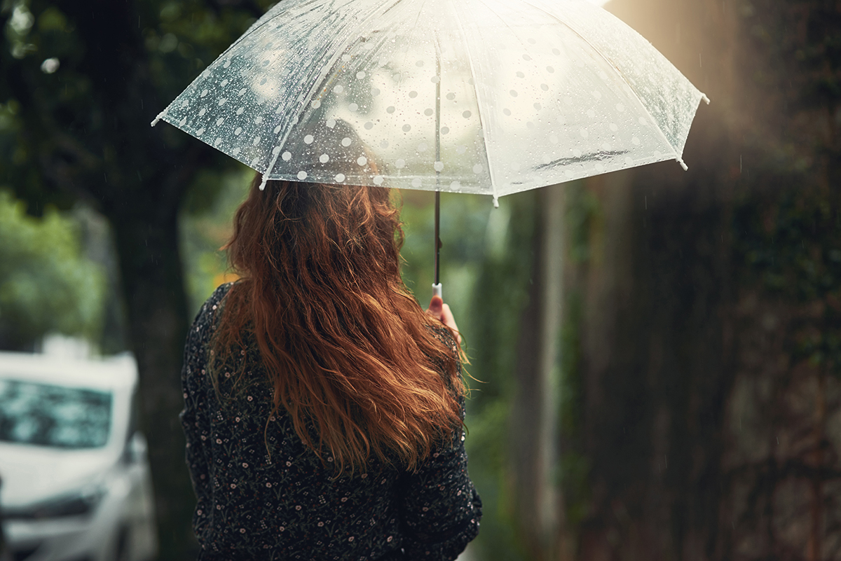 woman-under-umbrella-rain-protection