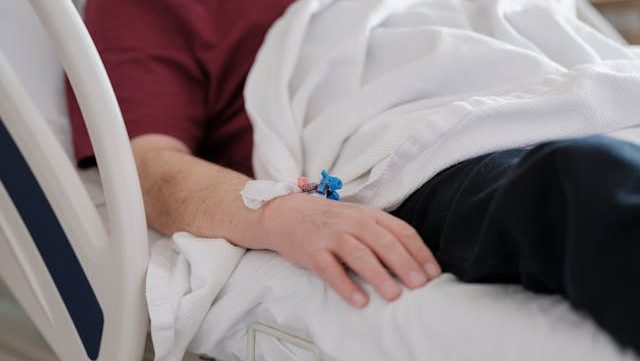 Person lying down on hospital bed