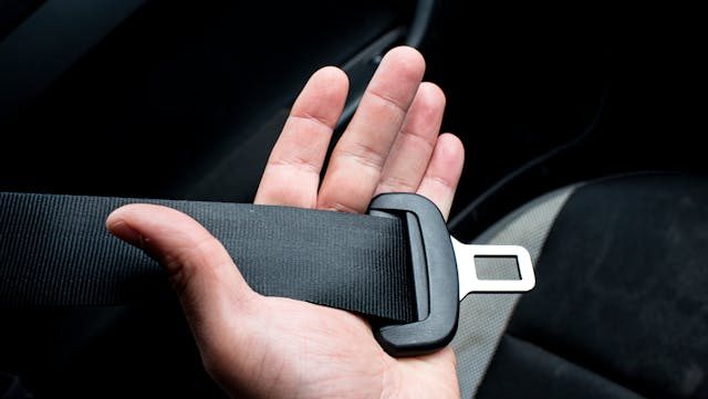 Seatbelt in palm of hand