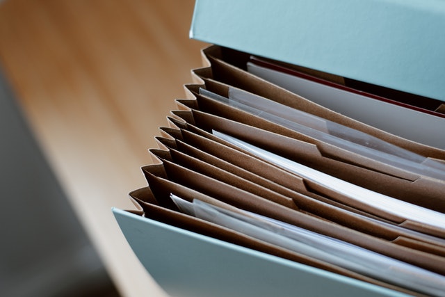 close-up-of-blue-file-containing-documents