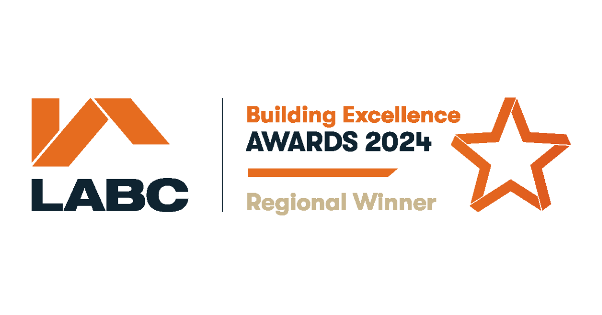 An orange and white house roof with the words 'LABC' in bold black text. To the right, it reads 'Building Excellence AWARDS 2024' in black and orange text, with 'Regional Winner' below in beige. There's an orange star to the right.