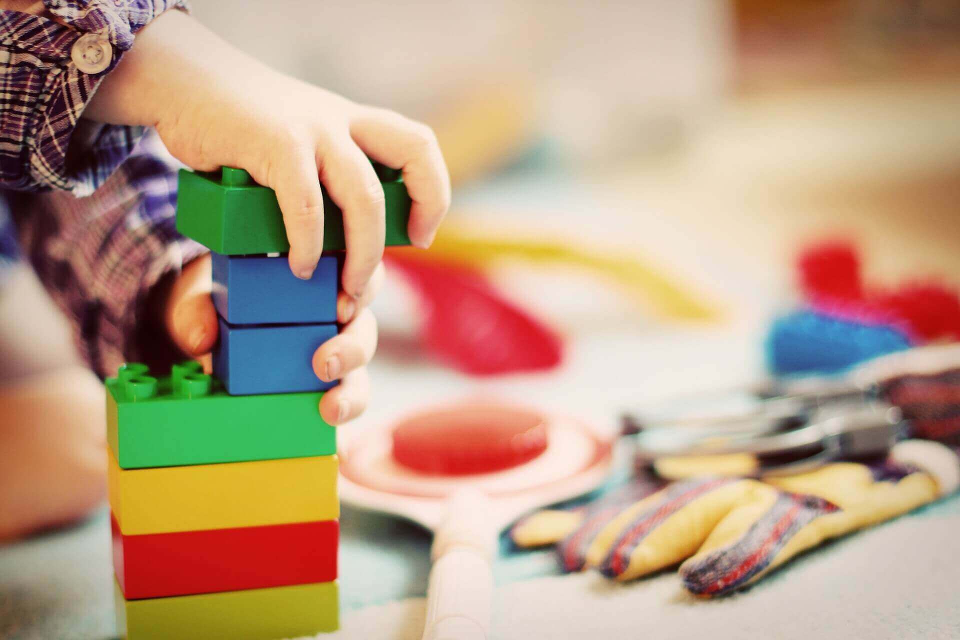 child-playing-with-colourful-building-blocks