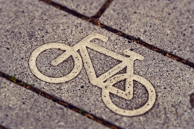 Cycle symbol on grey pavement