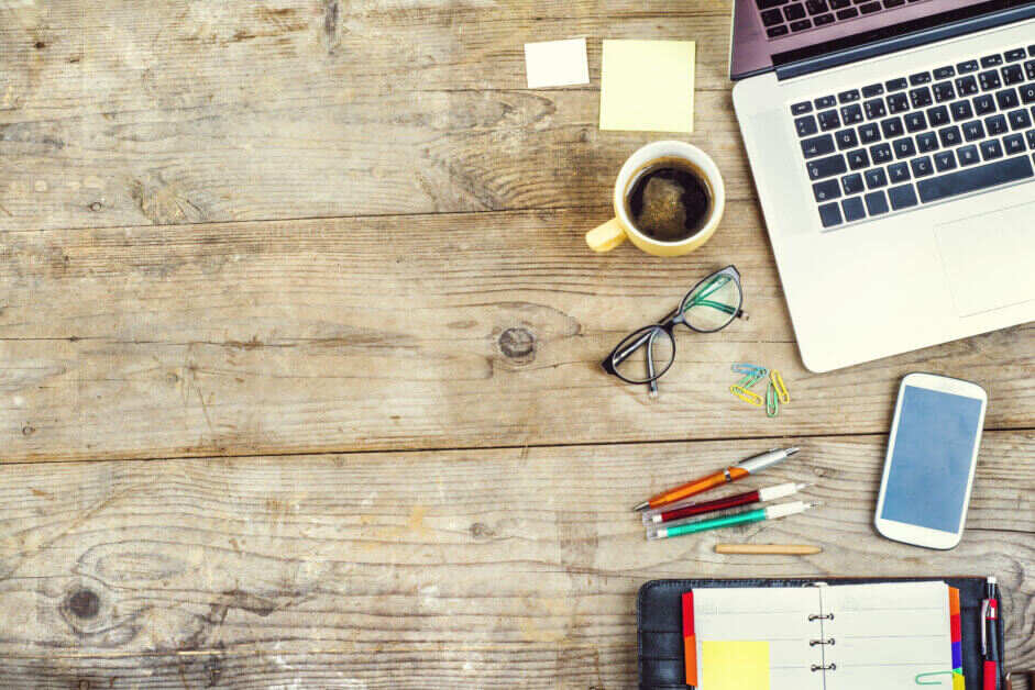 mug-and-laptop-on-wooden-work-desk