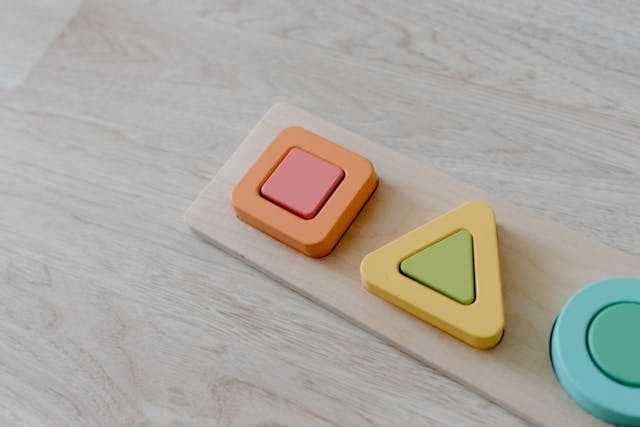 Colourful educational toy on a wooden surface