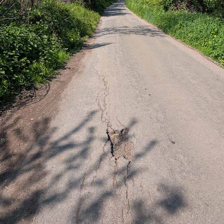 A pothole on a country road