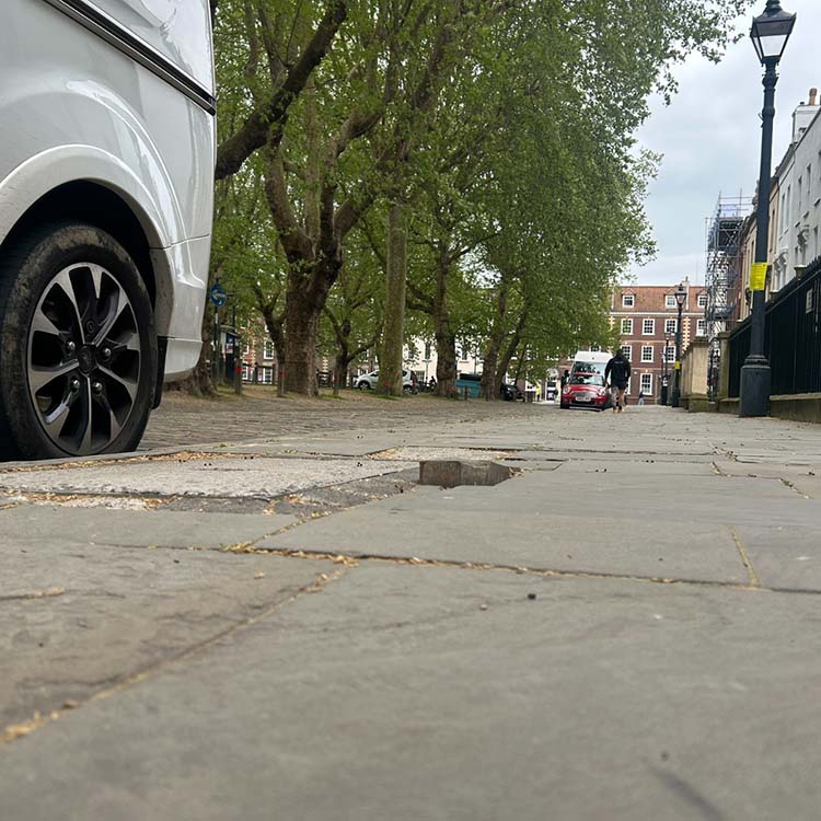 A photo showing the height of a pavement defect