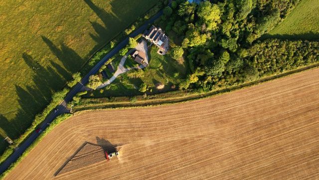 Drone shot of a house on farmland