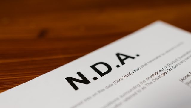 White paper with 'NDA' in bold black text at the top